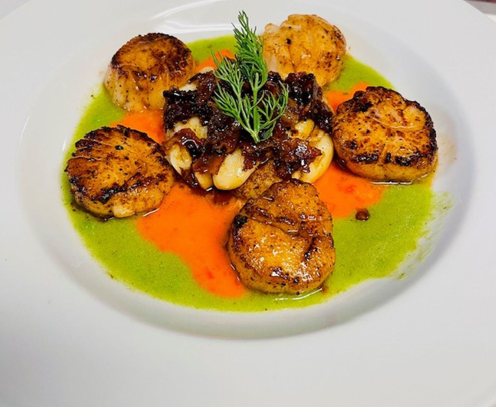 Scallops in sauce with pimento cheese gnocchi might be on the new menu.